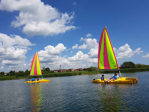 people sailing in hadleigh park