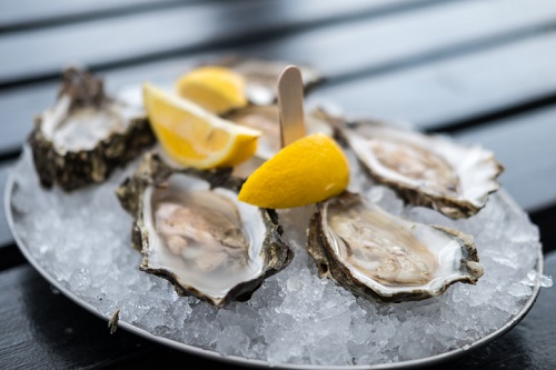 Oyster On Plate With Lemon.